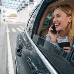 Woman enjoying a luxury limousine ride from San Francisco airport, relaxing after a flight, making the most of SFO limo service